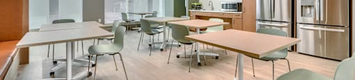 A conference room with a long table and chairs.