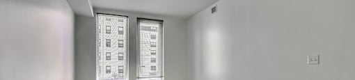 A room with a fire extinguisher on the wall.