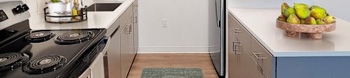 a kitchen with stainless steel appliances and a green rug