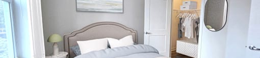 A bedroom with a large bed and a painting on the wall.