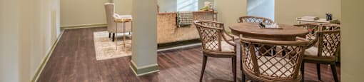 a dining room with a table and chairs and a couch