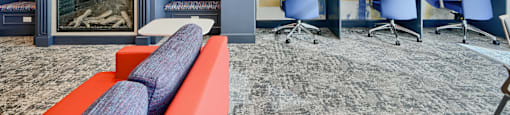 Now leasing senior 1-bedrooms in Baltimore, MD. A blue and yellow abstract painting on a wall.