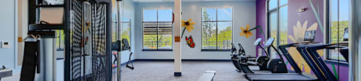 Now leasing senior 1-bedrooms in Baltimore, MD. A gym with treadmills, elliptical machines, and a bench.