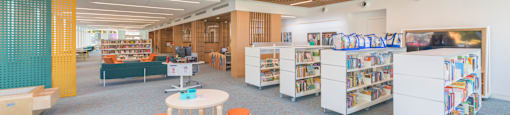 A library with a wooden ceiling and bookshelves.