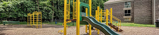 a playground with a slide and other playground equipment