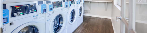 a washer and dryer in a laundry room with a counter
