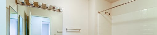 A bathroom with a toilet, sink, and bathtub.