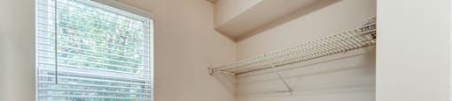 A small laundry room with a washer and dryer.