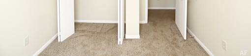 a bedroom with a closet and an open door