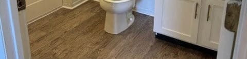 a bathroom with a toilet and a sink