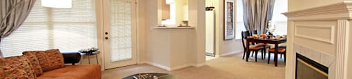 Spacious luxury apartments with woodburning fireplace, spacious dining room, and oversized windows at The Biltmore Apartments in Omaha, Nebraska