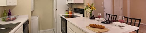 Bright white kitchen with lots of cabinet space, lots of counter space, spacious living room, breakfast bar, and washer and dryer in unit at LionsGate Apartments in Lincoln, Nebraska