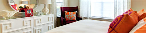 Large bedroom with large walk-in closet, crown molding, and 9-12 foot ceilings.