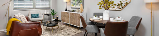 our apartments offer a living room and dining room with a table and chairs