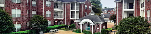 Luxury swimming pool with large sundeck at Tuscany Gate Apartments in Houston.