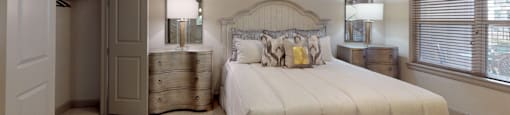 Spacious master bedroom to accommodate a king-size bed and dresser with walk-in closet and master bathroom at Tuscany Walk Apartments in Houston Texas.