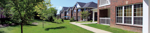 Luxury townhomes with attached garages, scenic views and red brick exteriors at Bellemeade Apartments in west Des Moines