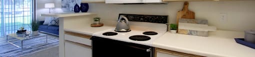 Spacious kitchen with extra cabinet space, extra counter space, tiled floors, bright white kitchen, at Tanglewood Apartments in Lincoln, Nebraska