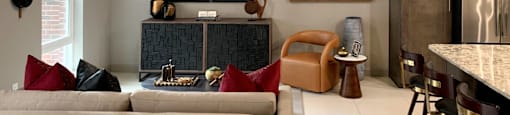Spacious living room, granite countertops and modern wooden cabinets at Xenia Apartments in Golden Valley, Minnesota