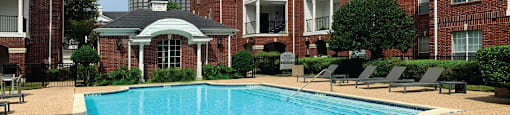 Luxury swimming pool with large sundeck at Tuscany Gate Apartments in Houston.