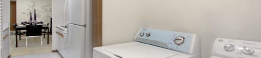 Apartments with full-size washer and dryer in unit, laundry room, bright white kitchen at LionsGate Apartments in Lincoln, Nebraska