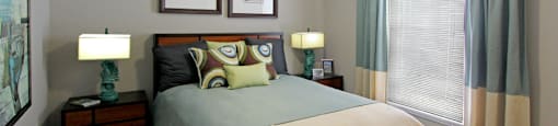 Spacious bedroom with walk-in closet and gray wall color at The Vanderbilt Apartments in Omaha, Nebraska