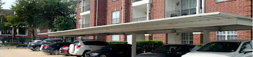 Luxury apartments with brick exteriors, covered parking, private storage, extra storage, at Tuscany Apartments in Houston.