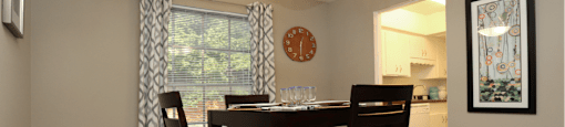 Spacious dining room and bright white kitchens at Plantation apartments in Houston.