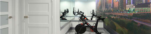 Newly remodeled Fitness Center open 24/7 with brand new Life Fitness equipment including 1 peloton bike, 4 resistance machines, 2 treadmills, 1 life cycle, 1 elliptical, full rack of free weights and dumbbells and water bottle refill fountain at Tuscany Apartments in Houston.