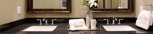 Spacious luxury bath suite with cultured marble vanity with double sinks and double mirrors Tuscany Walk Apartments in Houston