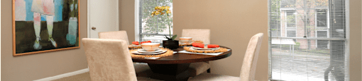 Spacious floor plan, spacious dining room with oversized windows and lots of natural light at Woodlake on the Bayou Apartments in Houston.