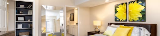 Huge master bedroom with attached walk-in closet and master bathroom, built-in shelves, spacious master bedroom at Embassy Park Apartments in Omaha, Nebraska
