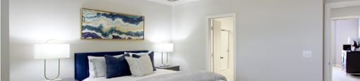 Huge bedroom, spacious bedroom with vaulted ceiling, ceiling fan, walk-in closet, and attached bathroom at Tuscany Villas Townhomes in Houston.