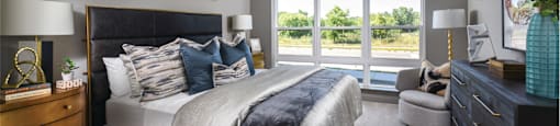 Luxury apartments with master bedroom to fit a king size bed, attached master bathroom and walk-in closet at Xenia Apartments in Golden Valley, Minnesota