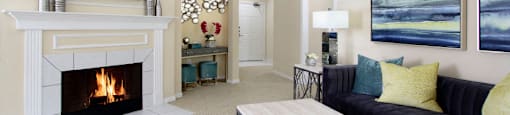 Luxury apartments with spacious open floor plan, woodburning fireplace, and oversized windows at TurtleCreek apartments in West Des Moines, Iowa