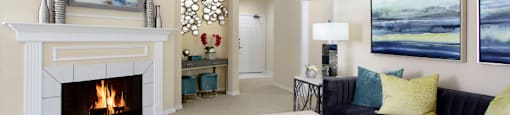 Luxury apartments with spacious open floor plan, woodburning fireplace, and oversized windows at Saddlebrook apartments in Urbandale, Iowa