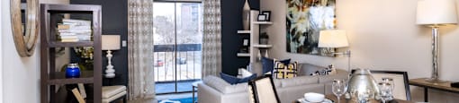 Spacious living room with colored feature wall at Embassy Park Apartments in Omaha, Nebraska