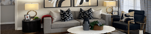 Luxury apartments with spacious living room, oversized windows, and plank wood floors at Saddlebrook apartments in Urbandale Iowa