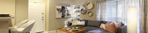 Spacious apartments with oversized windows, wood burning fireplaces, breakfast bar, and built-in shelves at The Dorchester Apartments in Houston.