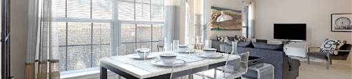 Apartments in southwest Omaha with open floor plan, open layout, spacious apartment, spacious living room, spacious dining room, lots of natural light, and oversized windows at Breckenridge Apartments in Omaha, Nebraska