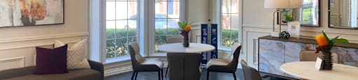 a living room with a table and chairs