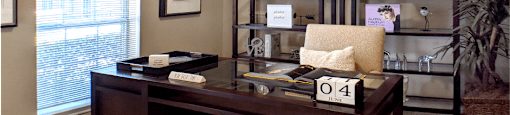 Gated apartment community near the Galleria with den or office space with wet bar at The Dorchester Apartments in Houston.