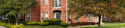 Luxury apartments located at 70th and Pioneers Blvd with red brick exterior and scenic views