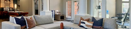 a living room with couches and a coffee table