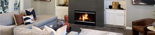 a living room with a fireplace and a couch