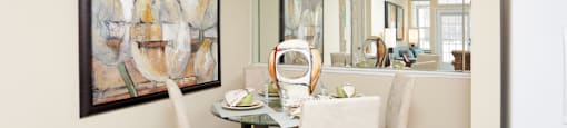 Luxury apartments with spacious dining room and mirror accent wall at Rockledge Oaks Apartments in Lincoln, Nebraska