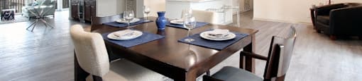 a dining room and living room with a table and chairs