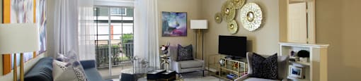 Luxury apartments in North Dallas with spacious floorplans, spacious living room, built-in shelves, 9-foot ceiling, and large balcony at Kensington Square Apartments.
