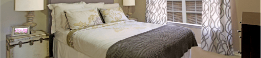 Spacious bedroom with large walk-in closet and 9-foot ceilings at The Biltmore Apartments in Omaha, Nebraska
