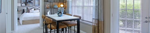 Spacious dining room with lots of natural light, huge windows, French door, and 9-foot ceilings at Breckenridge Apartments in Omaha, Nebraska